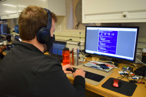 Engineer Collin Dobson performs function checks on OOI gliders