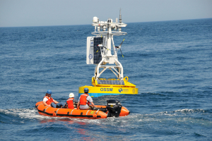 Coastal Pioneer small boat heading toward buoy