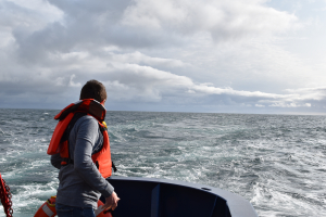 Andrew Reed tossing SOFAR spotter buoy