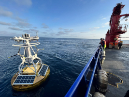 Buoy brought along side of ship for recovery