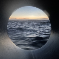 Porthole view at 2 am light skies