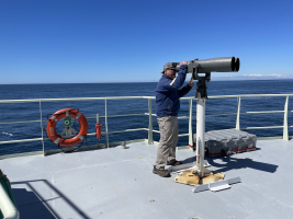 Marine mammal researcher Pete Duley using "Big Eyes"