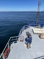 Marine mammal researcher Pete Duley on bow