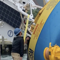 Chris Basque supervises loading of surface mooring
