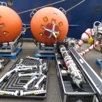 Mooring equipment and sensors are arranged and tested on UW pier in Seattle prior to loading on ship. (Photo Credit: Brian Beanlands, Department of Fisheries and Oceans, Canada)