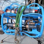 A near surface instrument frame. The near surface instrument frame sits about 7 meters beneath the surface mooring. It includes a wide variety of physical, chemical and bio-optical sensors. To mitigate biofouling, the frame has blue antifouling paint. Copper tubing and copper tape is used on instruments for the same purpose. (Photo Credit: OOI Endurance Array Program, OSU)