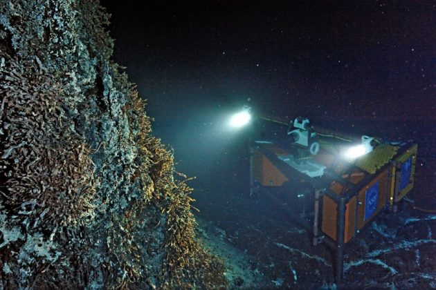 A high-definition camera built by the University of Washington’s Applied Physics Laboratory is trained on the 13-foot-tall, actively venting hot spring called Mushroom at the summit of the Axial Seamount, about a mile deep in the Pacific off the Oregon coast. (UW / NSF-OOI / CSSF Photo)