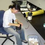 Maintenance of acoustic instrument during her MS program in University of Maine (Darling Marine Center). Credit: Mei Sato