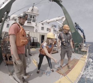 Deploying a bottom pressure recorder during an axial cruise. Photo Credit: Haley Cabaniss