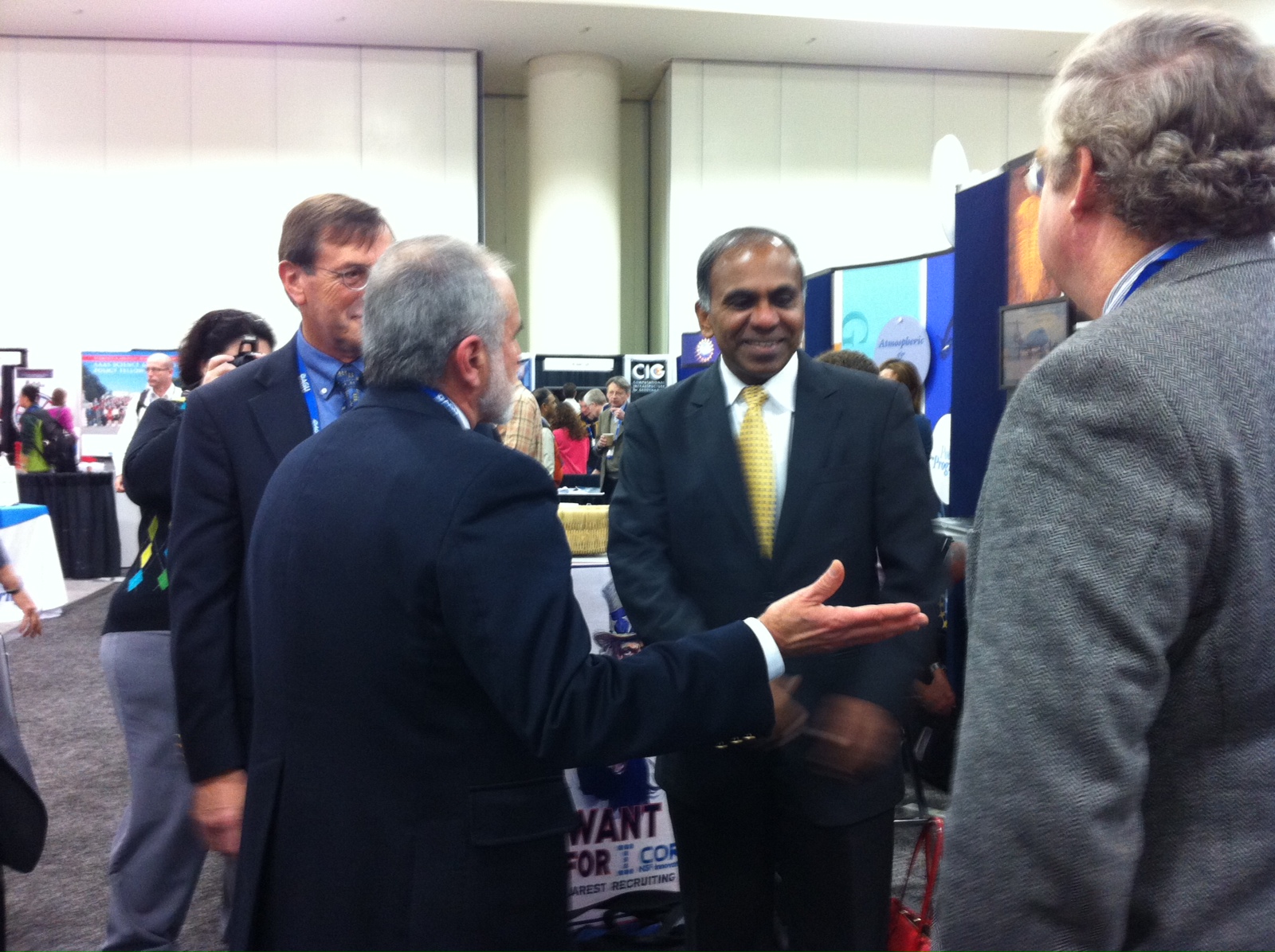 Tim Cowles, Vice President & Director of Ocean Observing at the Consortium for Ocean Leadership and Bob Gagosian, President and CEO of the Consortium for Ocean Leadership meet with Subra Suresh, Director of the National Science Foundation in the exhibit hall. (Photo Credit: Julie Farver, Senior Manager, Meetings and Travel, Consortium for Ocean Leadership)