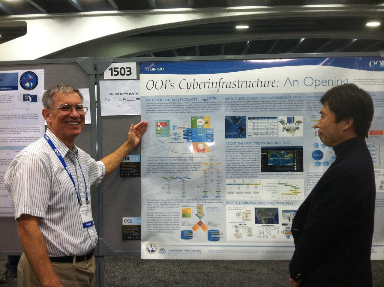 John Graybeal, Product Manager of the OOI Cyberinfrastructure (CI) presents a poster explaining the basics of the OOI Cyberinfrastructure, (Photo Credit: Debi Kilb, CI Communications)