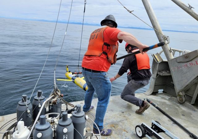 Figure x: NSF OOI Endurance Array staff recover glider 384 to adjust its ballast before sending it on its mission over the Oregon Shelf.  Photo credit: Scarlett Arbuckle (Oregon State University)