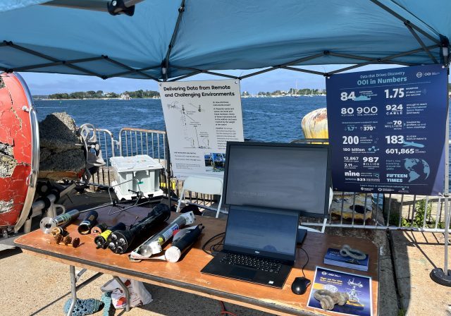 Figure 2. The OOI booth at the 2026 Woods Hole Science Stroll. Credit: Nikki Arm, Woods Hole Oceanographic Institution.